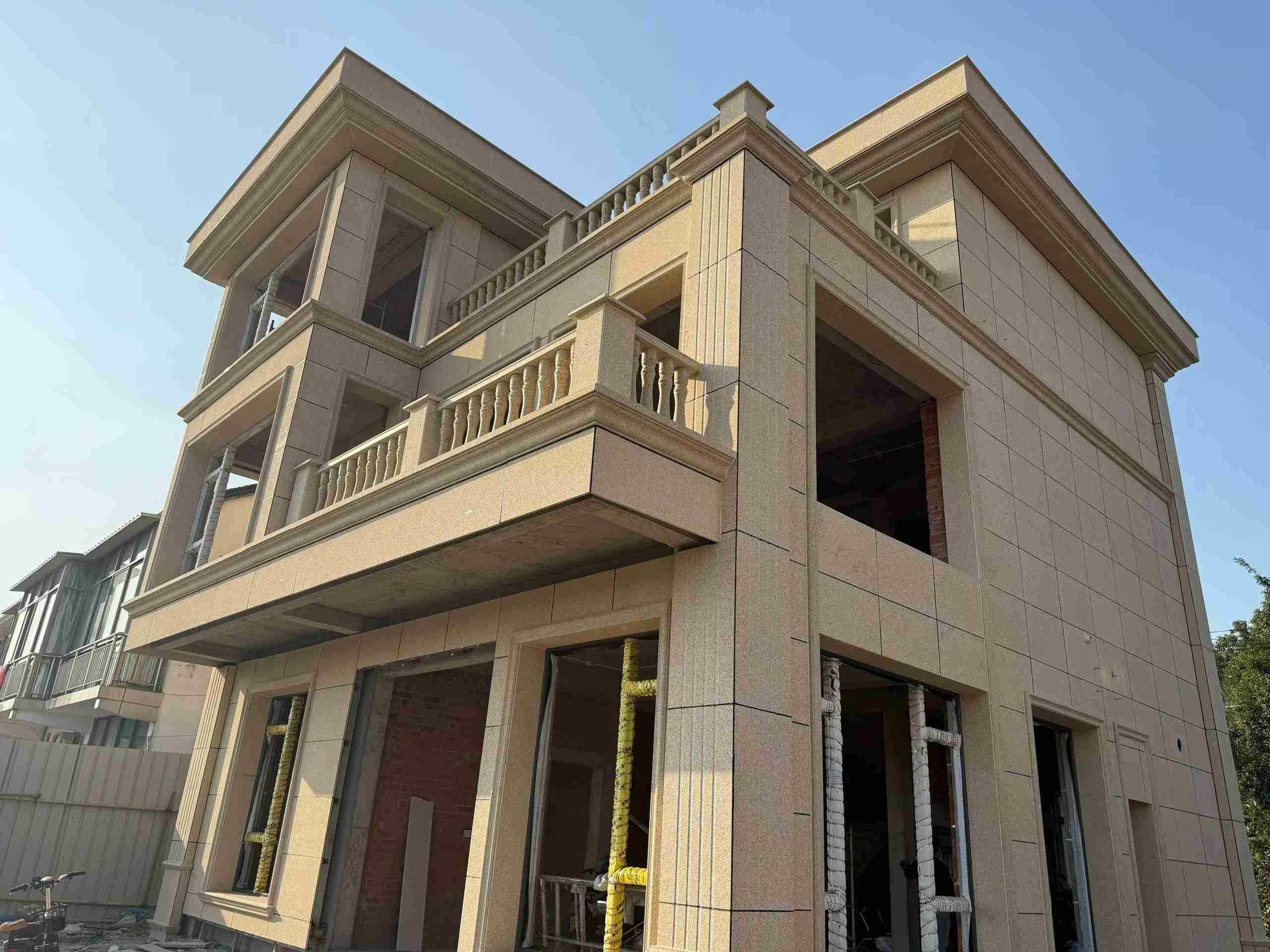 吉林省 黄金麻花岗岩石材荔枝面外墙干挂效果展示